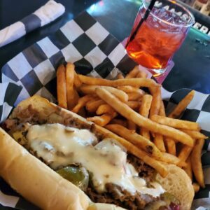 Doc Enjoys The Philly Steak And Cheese From Grease Monkeys Sports Bar And Grill