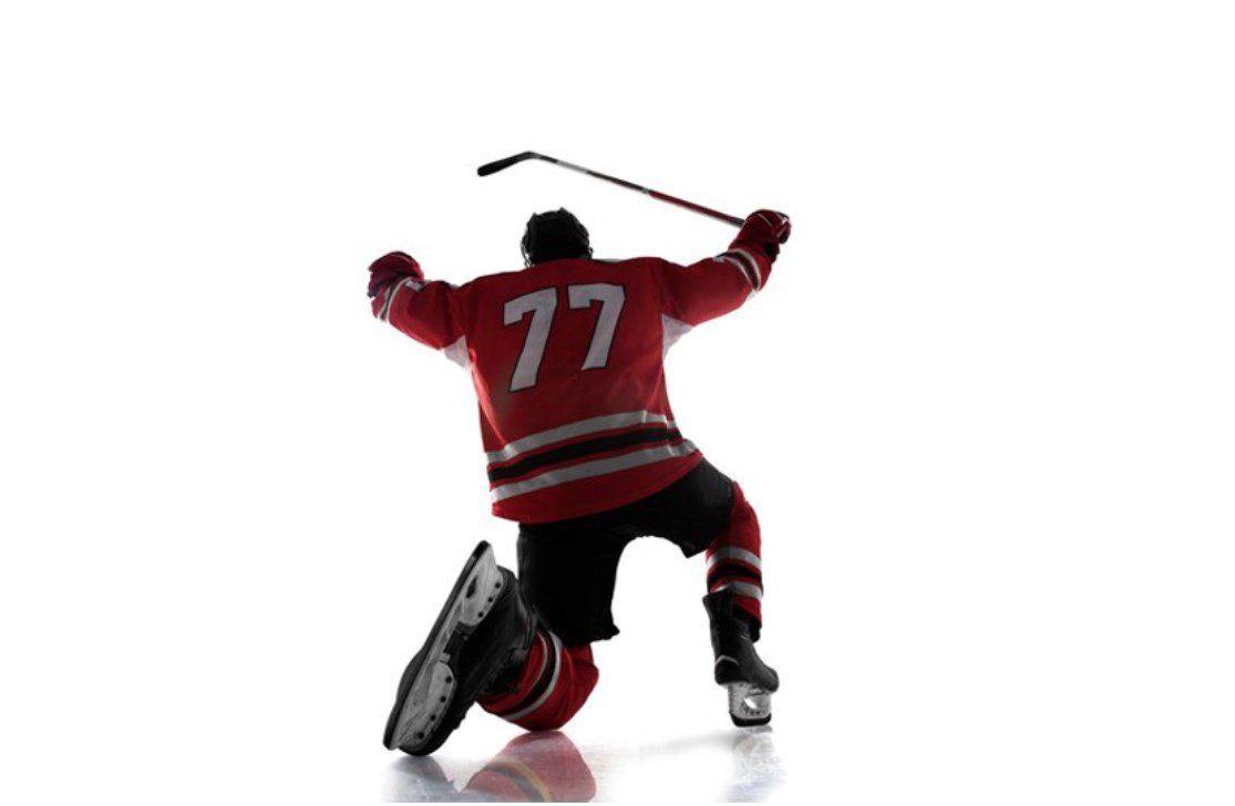 Hockey player celebrating on ice - QuadCities.com