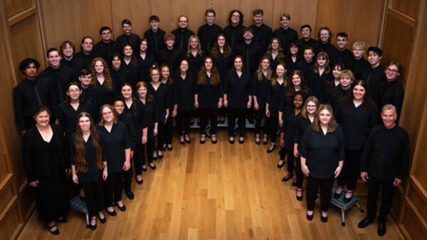 Dr. Jon Hurty (lower right) pictured with the Augustana Choir, which toured Nebraska, Colorado and Kansas in March 2025.