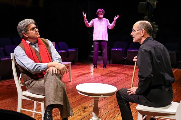 Tom Akers, left, as Sherlock Holmes, with Jason Schaad as Dr. Timothy Cratchit and Glenn Kluge at rear as Ebeneezer Scrooge.