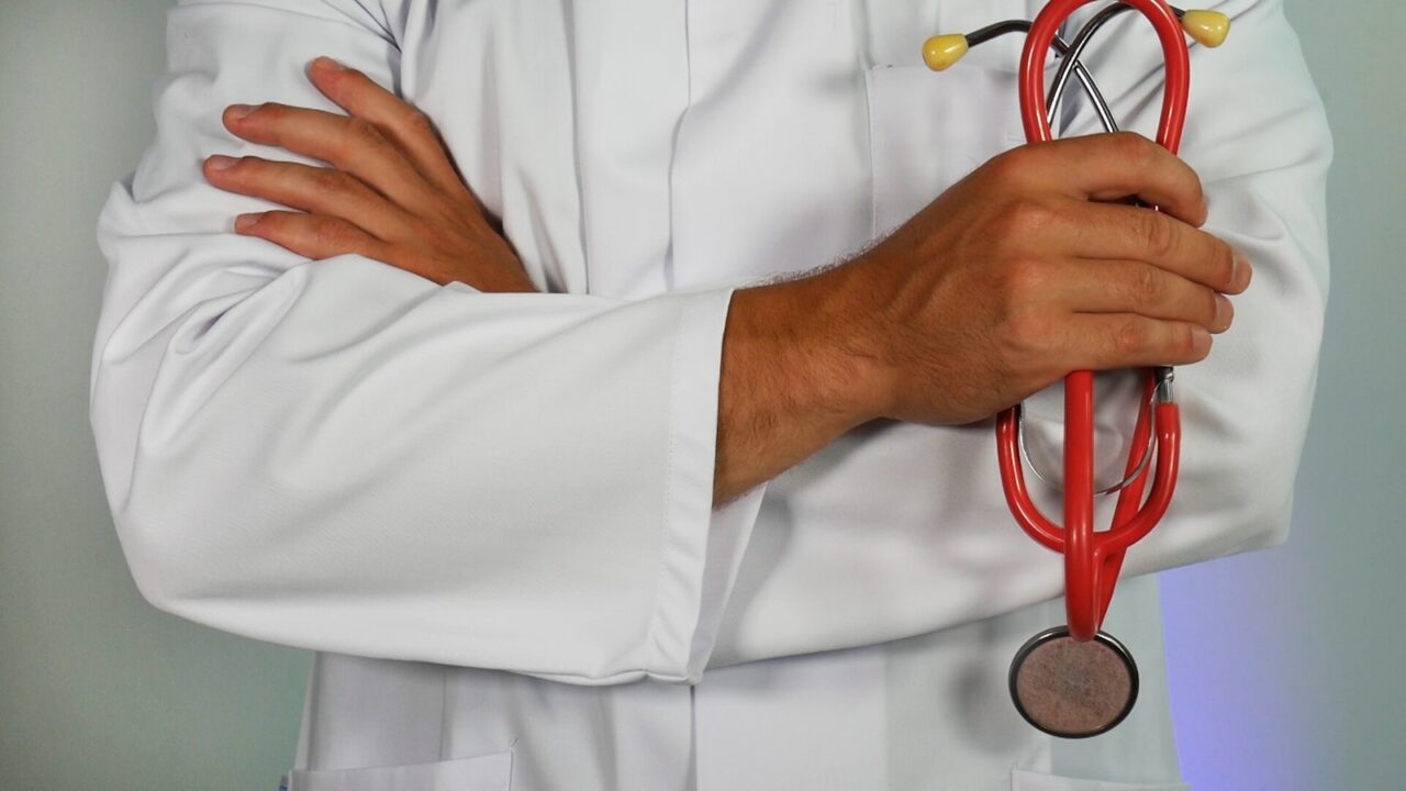 doctor holding red stethoscope health healthcare