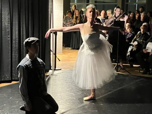 Ballet Quad Cities dancers Marcus Pei and Madeleine Rhode, accompanied by QCSO violinist Emily Nash, at the Putnam balcony, Feb. 17, 2026 (photo by Jonathan Turner).