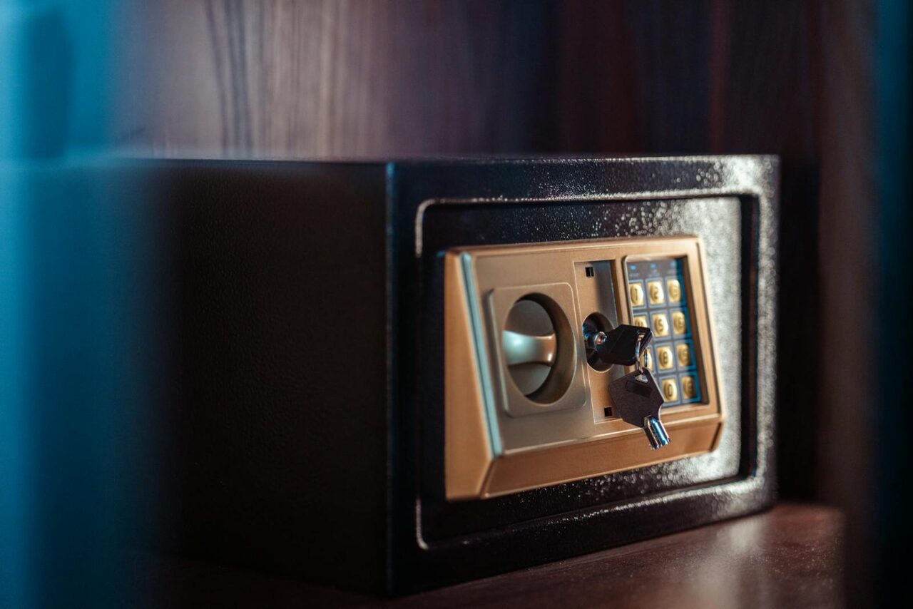 Close-up image of an electronic safe with a key