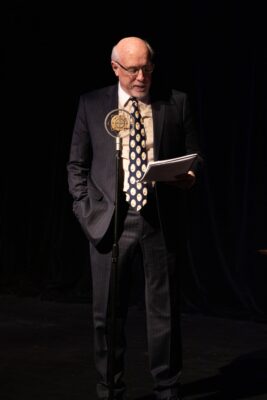 Playwright Jeff Adamson in his radio play, "The Adventures of Sam Steele."
