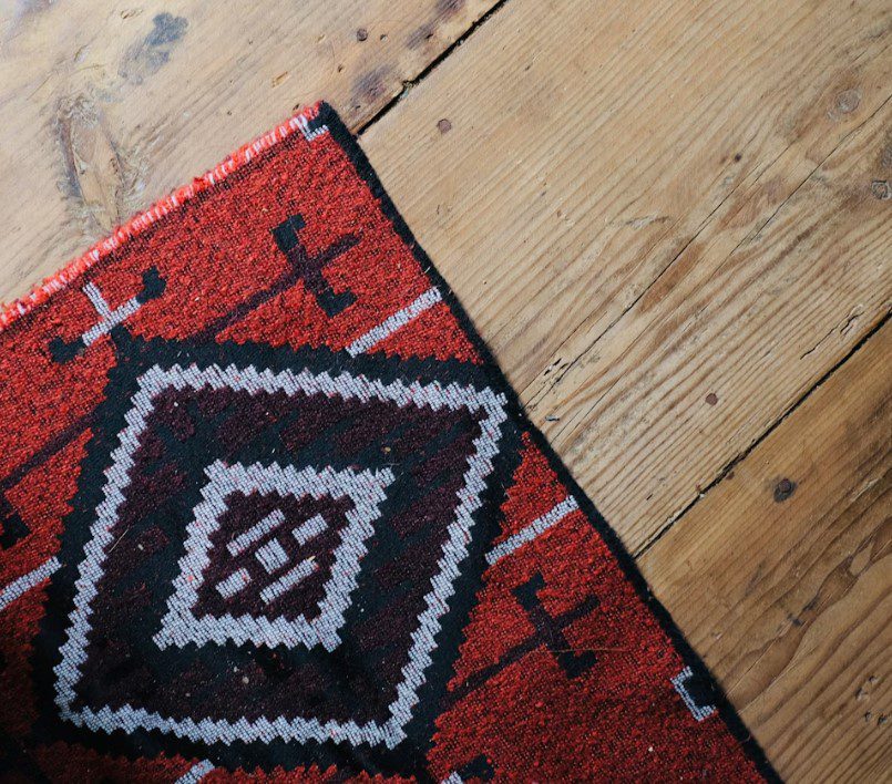 red, black, and white tribal print mat