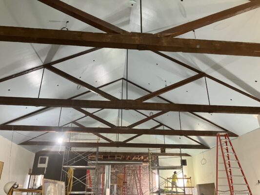 The interior drop ceiling was removed and the original beams are being restored (photo by Jonathan Turner).