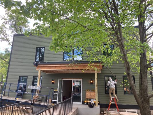 New siding has been put on, and a new entrance will go on the renovated former Village Theatre, 2113 E. 11th St., expected to open in June as Town Hall East (photo by Jonathan Turner).