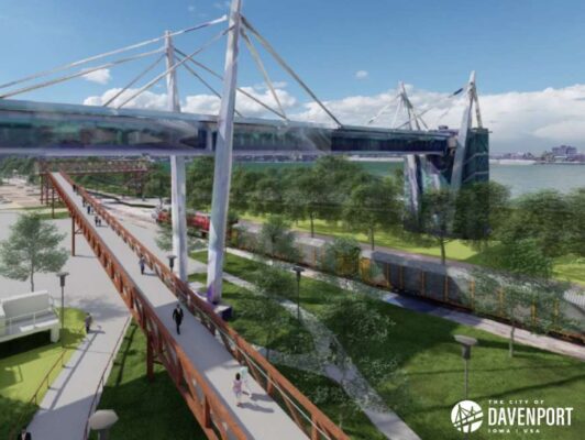 The Main Street Landing riverfront recreational area (pictured with the existing Skybridge) will include a pedestrian bridge over the railroad tracks and railroad quiet zones.