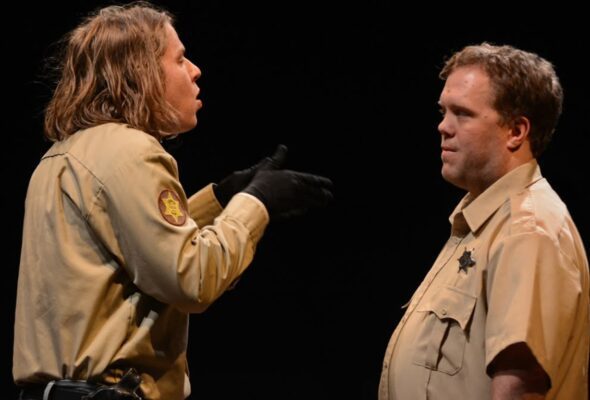 Perin Royalty (left) as File and Alex Claus as Sheriff Thomas.